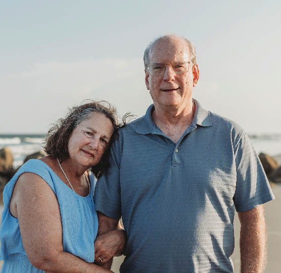 Bob Hodge with his wife standing beside him.